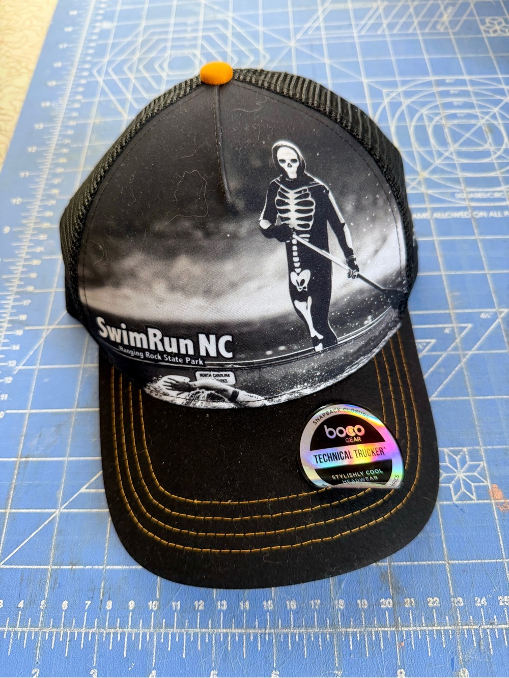 Boco Gear black and white SwimRun NC Skeleton Trucker Hat